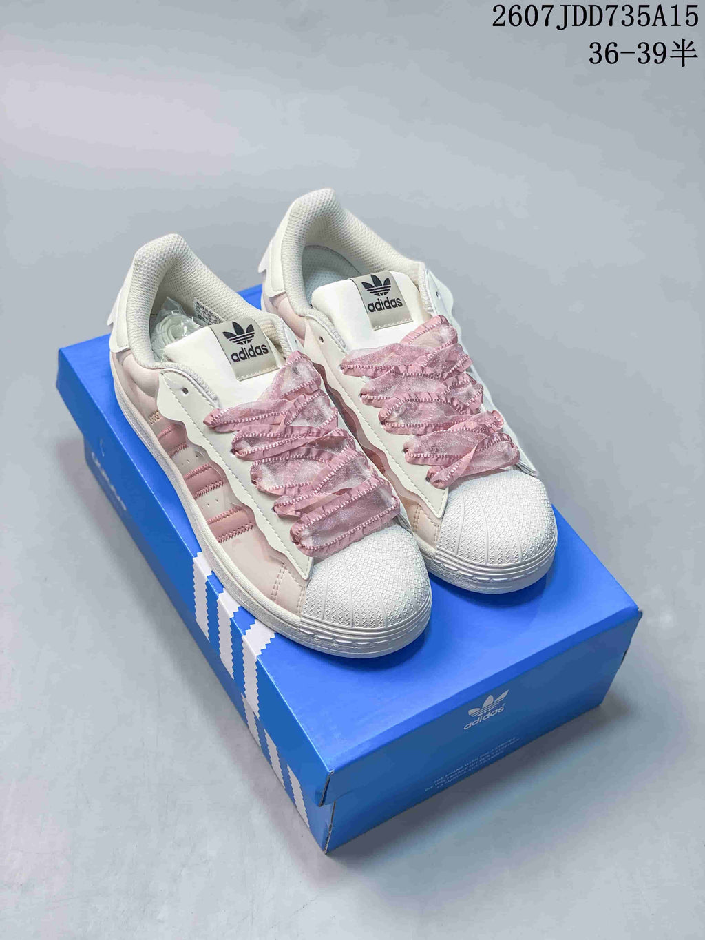 adidas Superstar Sneakers in White and Pink 2607JDD735A15 - product image from the listing.