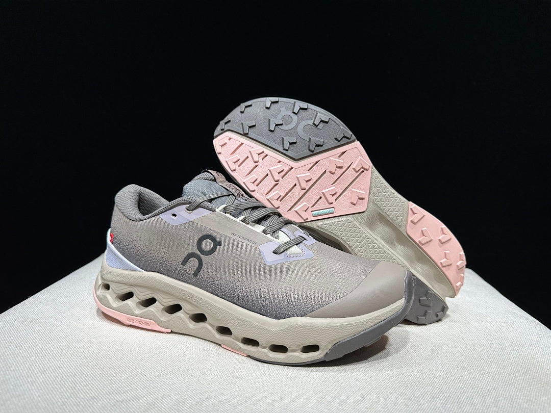 On Cloudsurfer Trail 2 Waterproof Trail Shoes Pink/Brown in Grey - product image from the listing.