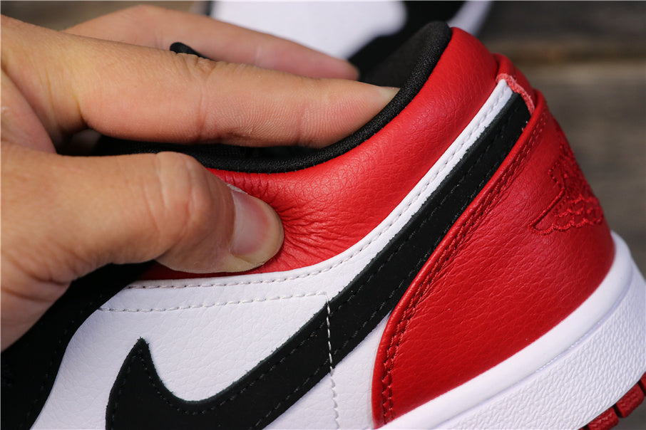 Air Jordan 1 Low Black Toe Red, Sneakers in White and Black - product image from the listing.