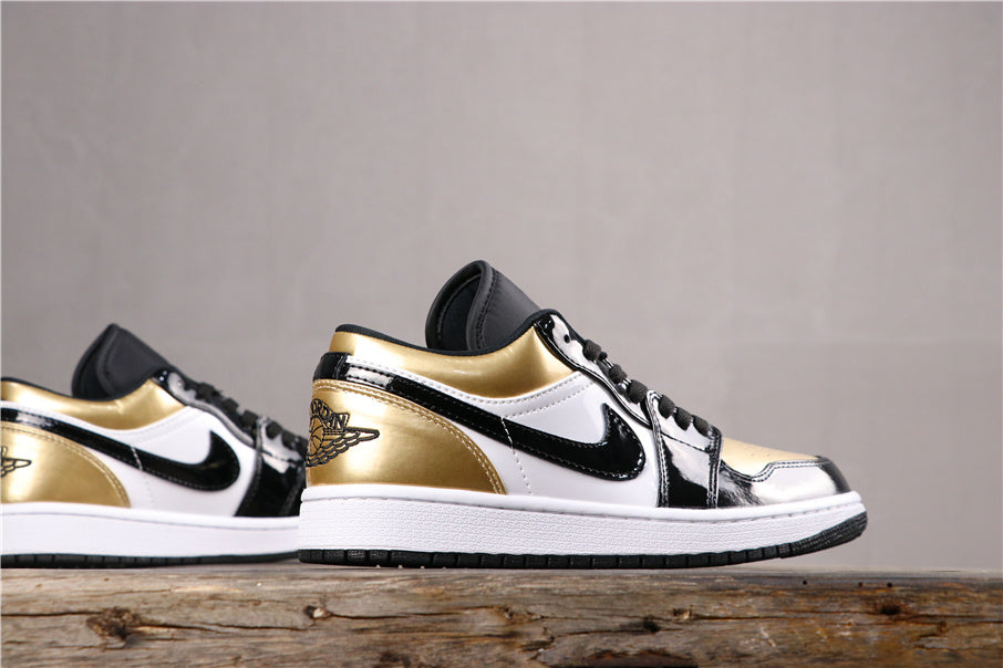 Jordan 1 Low Sneakers in Black Gold CQ9447-700 - product image from the listing.