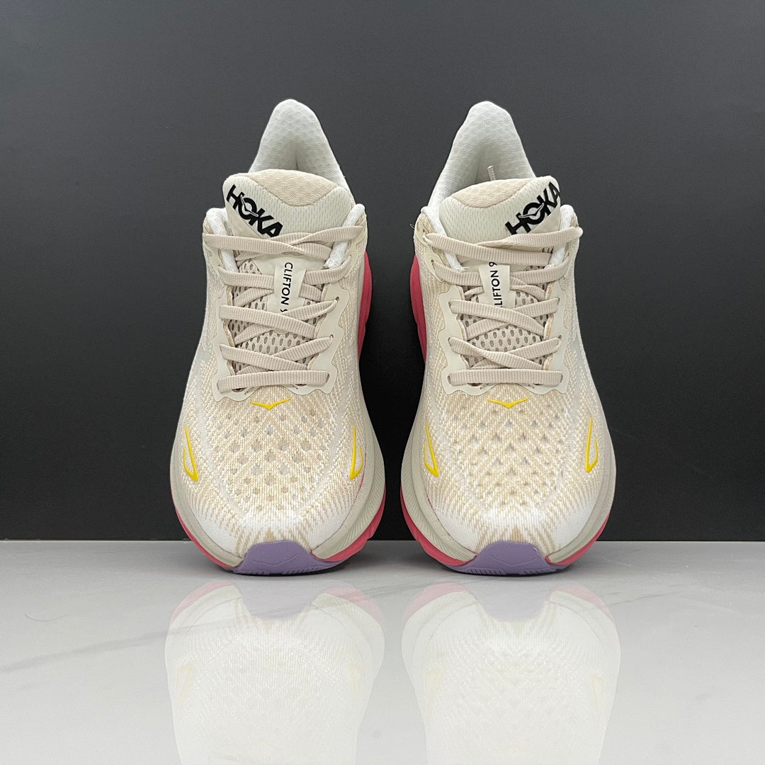 Ivory and Pink HOKA Clifton 9 Running Shoes - product image from the listing.