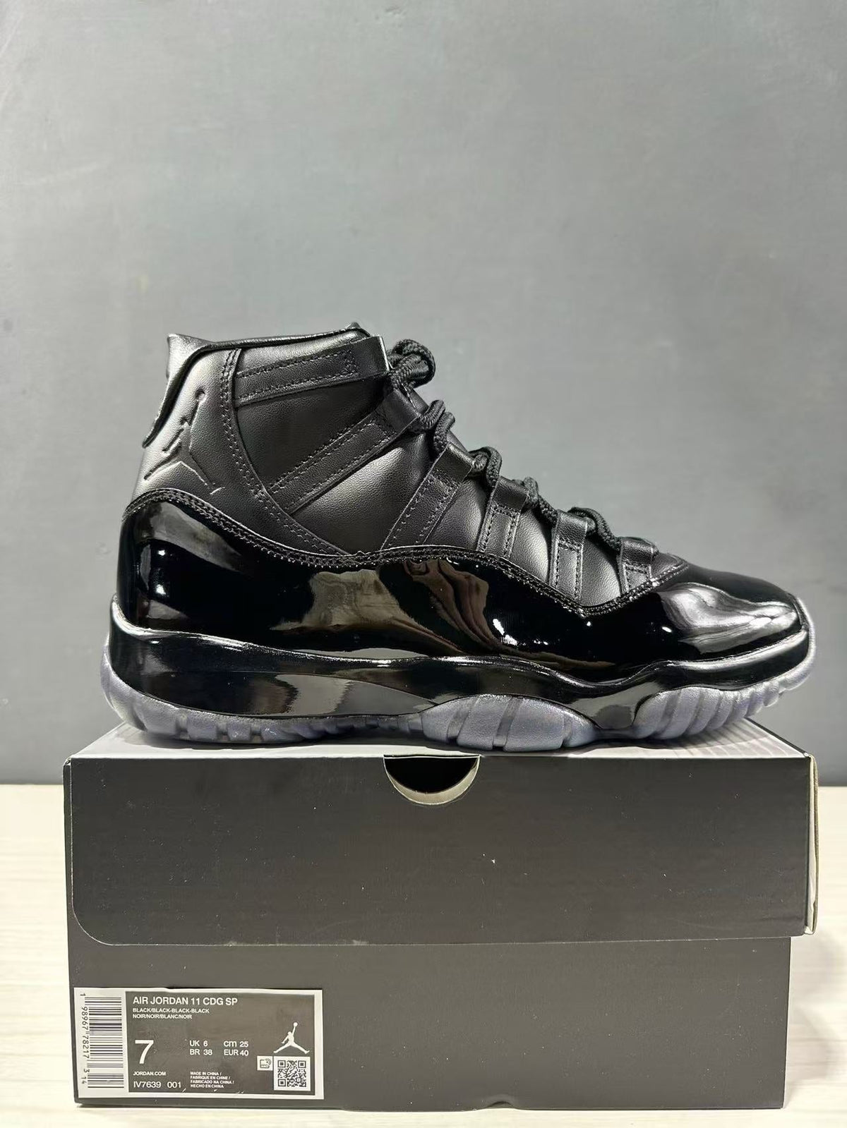 Comme des Garçons × Jordan Air Jordan 11 Sneakers in Black - product image from the listing.