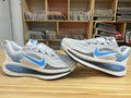 Nike Vomero 18 Running Shoes in White Blue - product image from the listing.