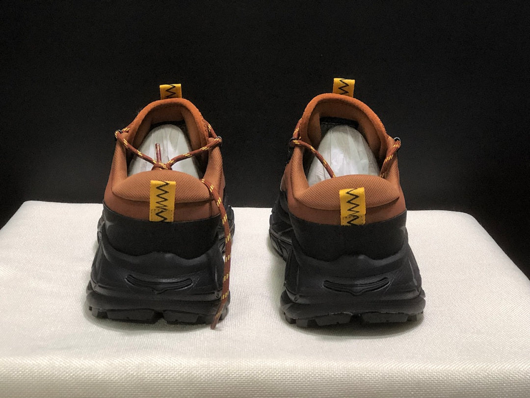 Brown and Black HOKA Tor Summit Hiking Shoes - product image from the listing.