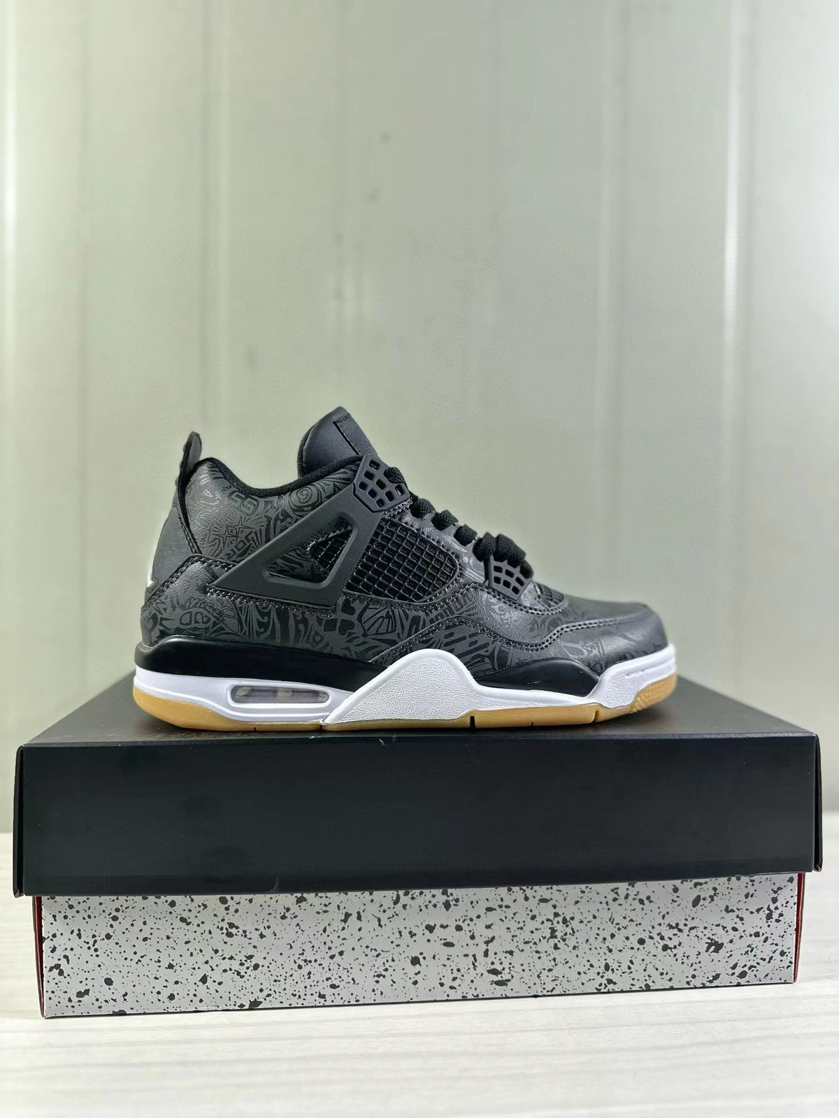 Air Jordan 4 Black Laser Sneakers CI2970-001 - product image from the listing.