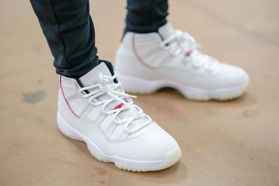 Air Jordan 11 Platinum Tint White High-Top Sneakers - product image from the listing.