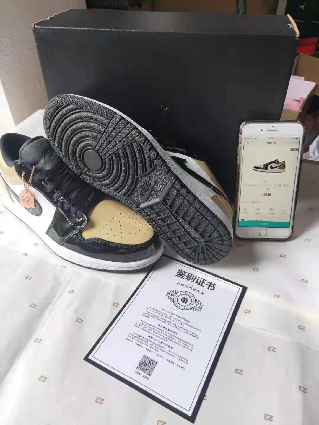Jordan 1 Low Gold Toe Sneakers in Black and Metallic Gold - product image from the listing.