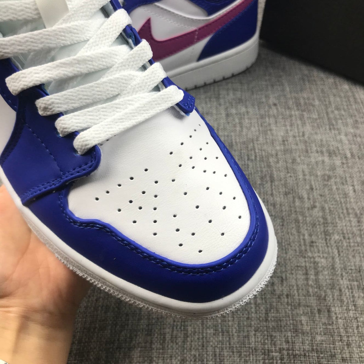 Air Jordan 1 Mid Sneakers in Blue Pink 554724-451 - product image from the listing.