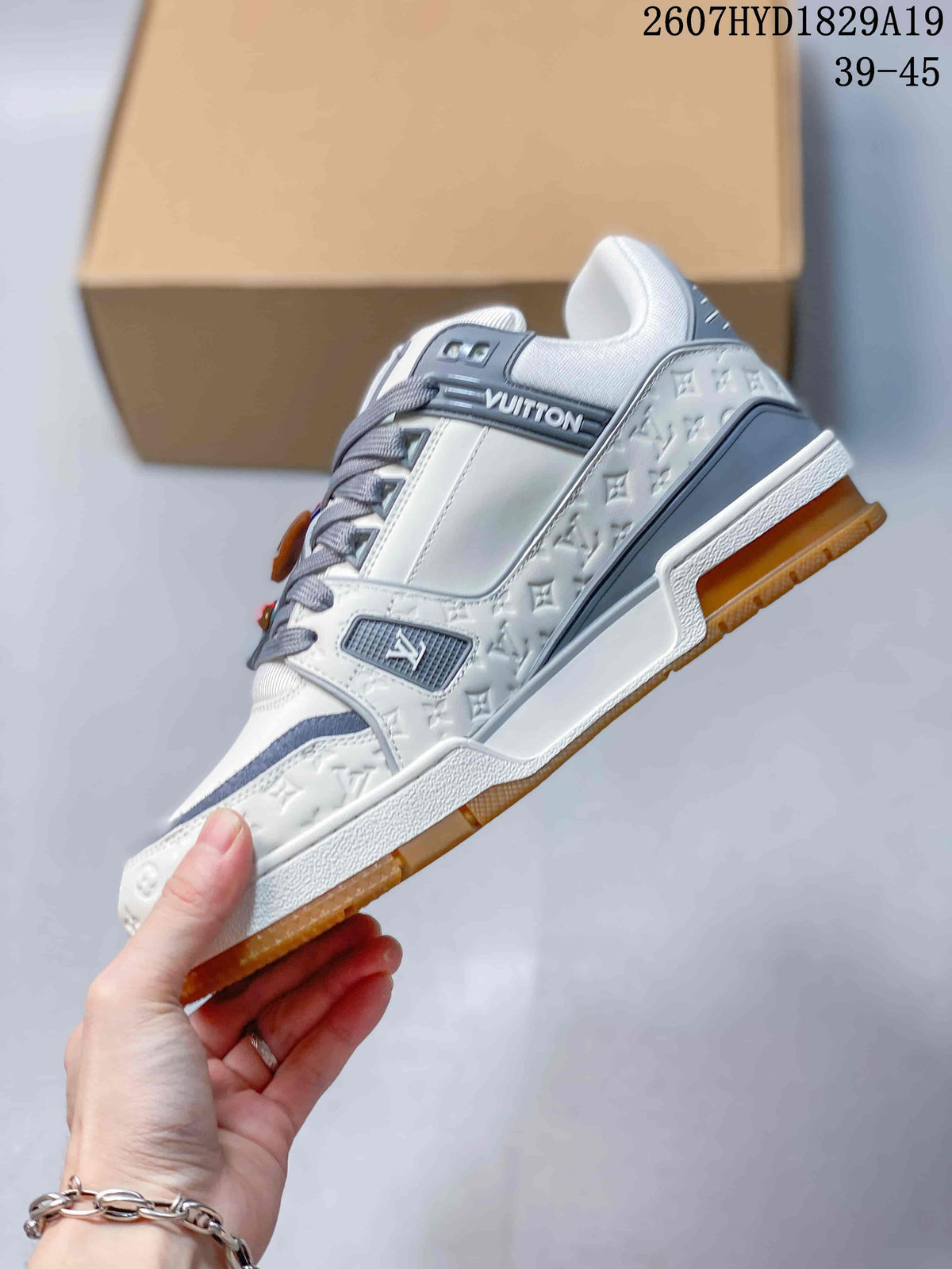 Louis Vuitton Trainer Maxi Low-Top Sneakers in White Gray - product image from the listing.
