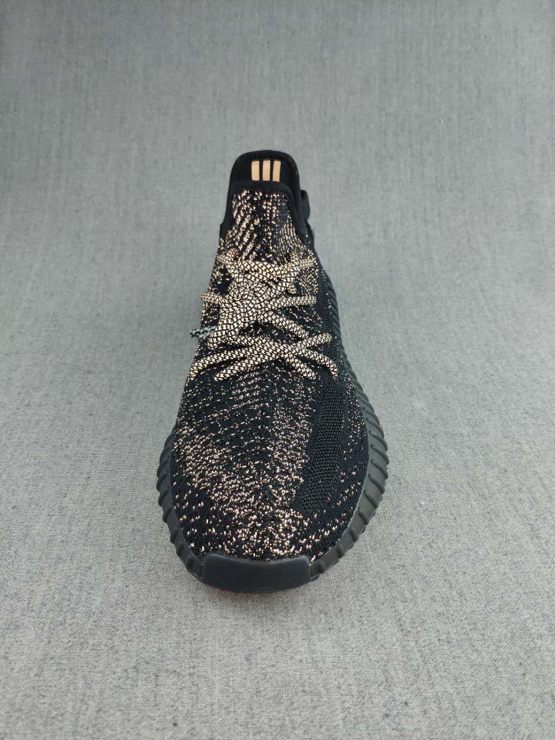 Black and Cream Yeezy 350 V2 Knit Sneakers - product image from the listing.