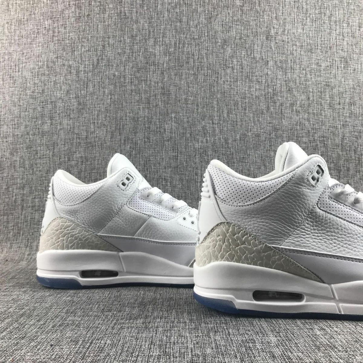 White Cement Sneakers with Blue Translucent Sole - Jordan 3 - product image from the listing.