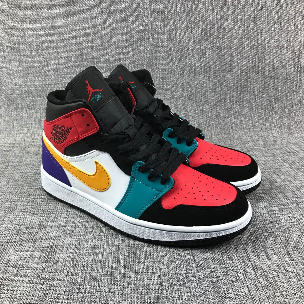 Jordan 1 Mid High-Top Sneakers in Multicolor - product image from the listing.