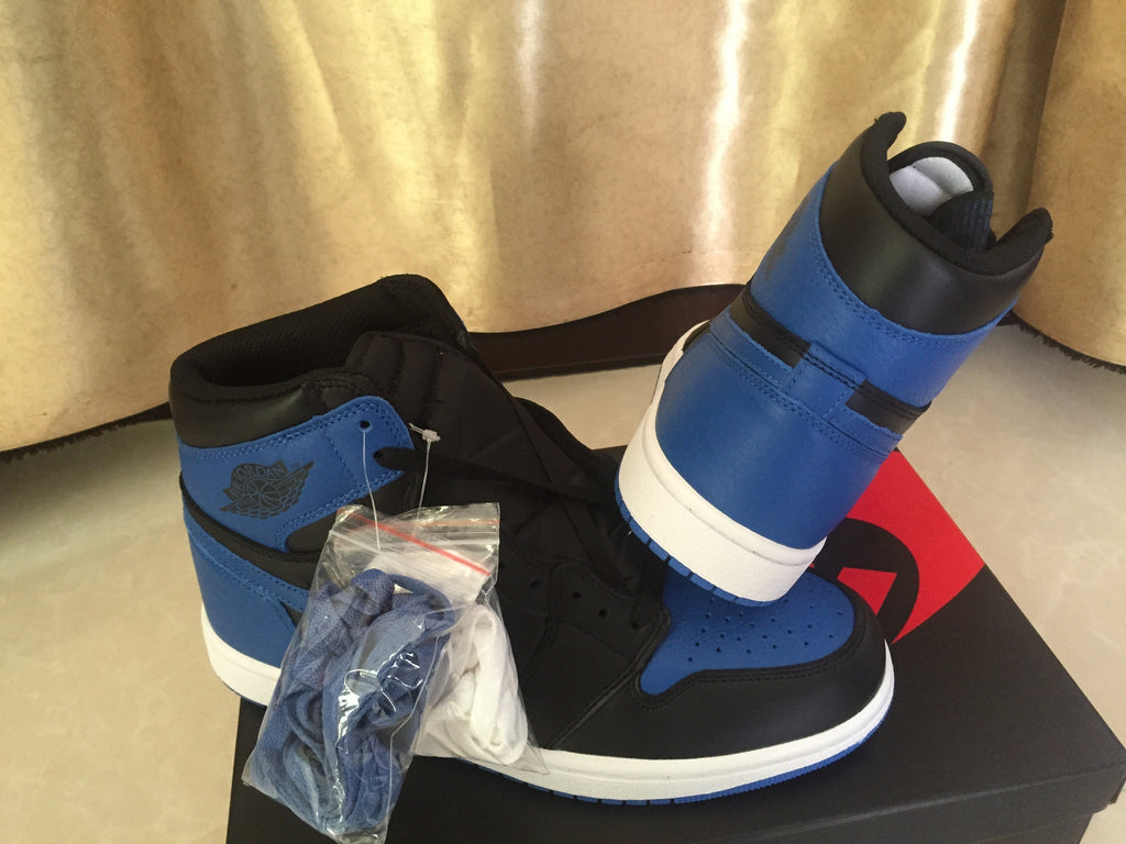 Jordan 1 High Sneakers in Black and Royal Blue - product image from the listing.